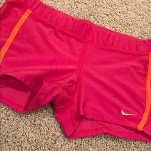 Pink and orange Nike dri fits